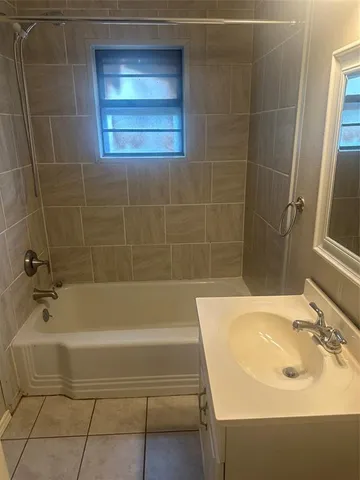 a bathroom with a sink and a bathtub