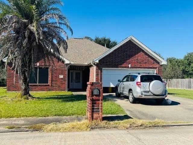 a front view of house with yard slide and fire pit