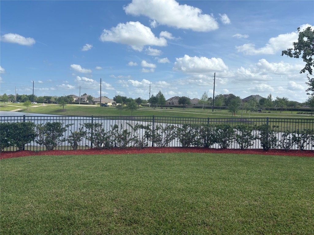 5139 Spring Terrace Lane Rosharon, TX 77583 - Photo 3 of 5 a view of a golf course with a lake
