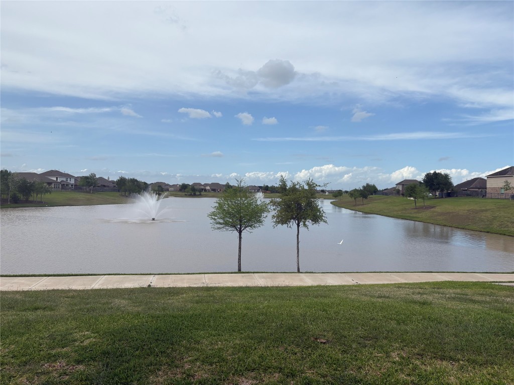 5139 Spring Terrace Lane Rosharon, TX 77583 - Photo 4 of 5 a view of a lake with houses in the back