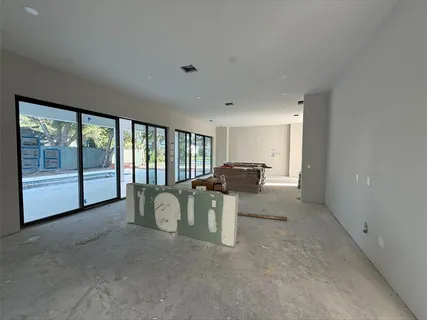 a view of livingroom with furniture and floor to ceiling window