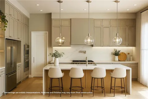 a kitchen with stainless steel appliances kitchen island granite countertop a table and chairs in it