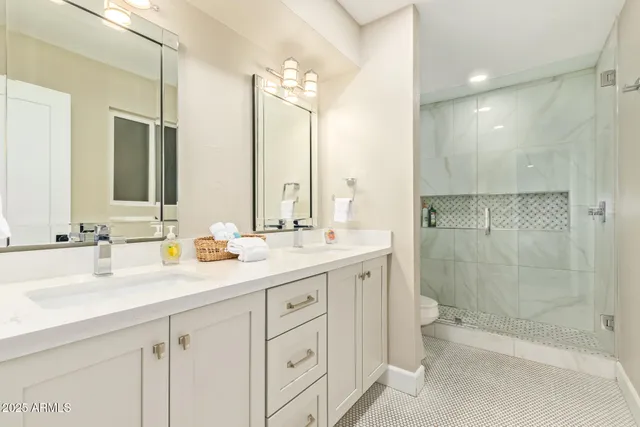 a bedroom with a bed and cabinet