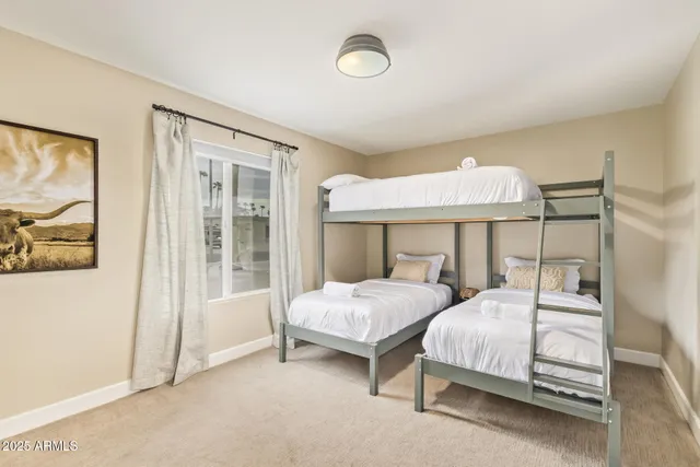 a bathroom with a double vanity sink mirror double and shower