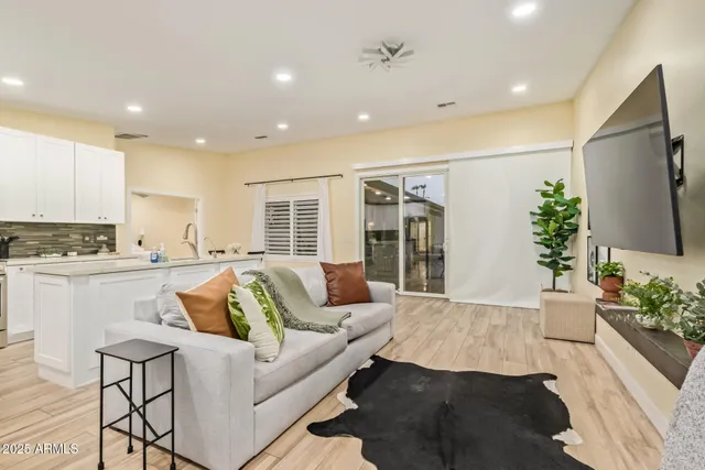 a bathroom with a toilet a sink a vanity and mirror
