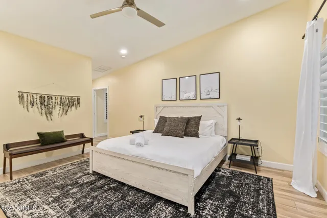 a large kitchen with kitchen island a sink appliances and cabinets