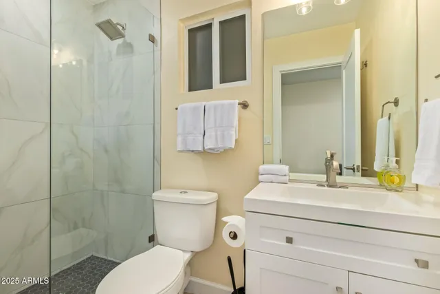 a bedroom with a bed and a table