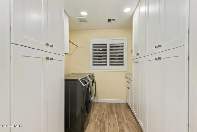 a view of a room with a table and chairs