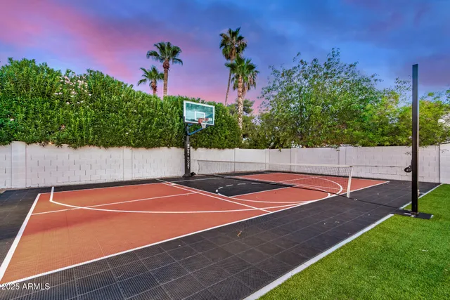 a view of living room with furniture and wooden floor