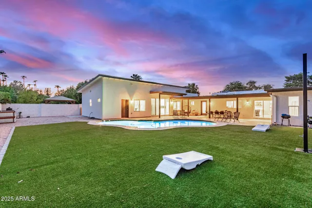 a view of a swimming pool with an outdoor seating