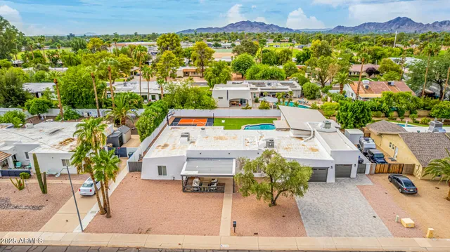 an aerial view of a swimming pool and mountain view