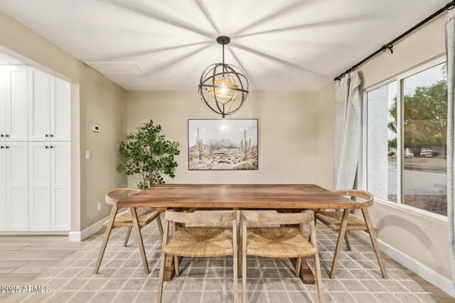 a view of a room with furniture and wooden floor