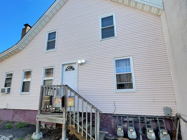a view of a brick building with many windows