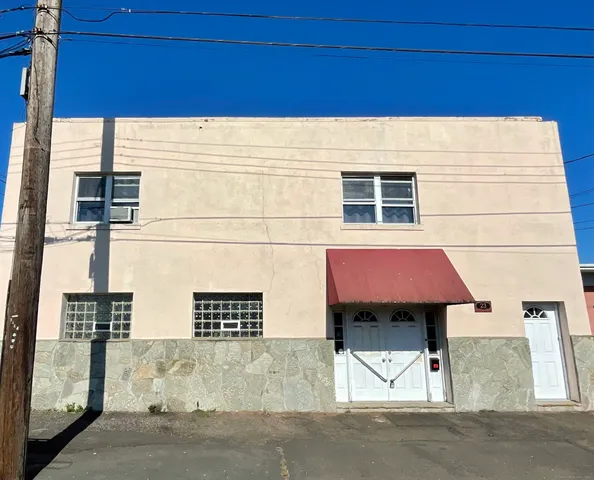 a couple of cars parked in parking lot a big yard