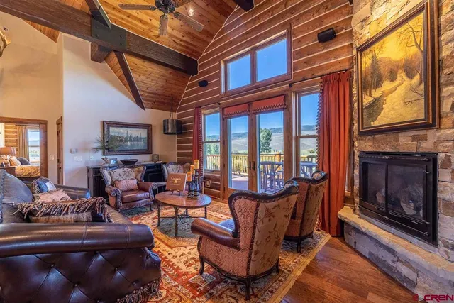 a view of a lush green hillside and houses