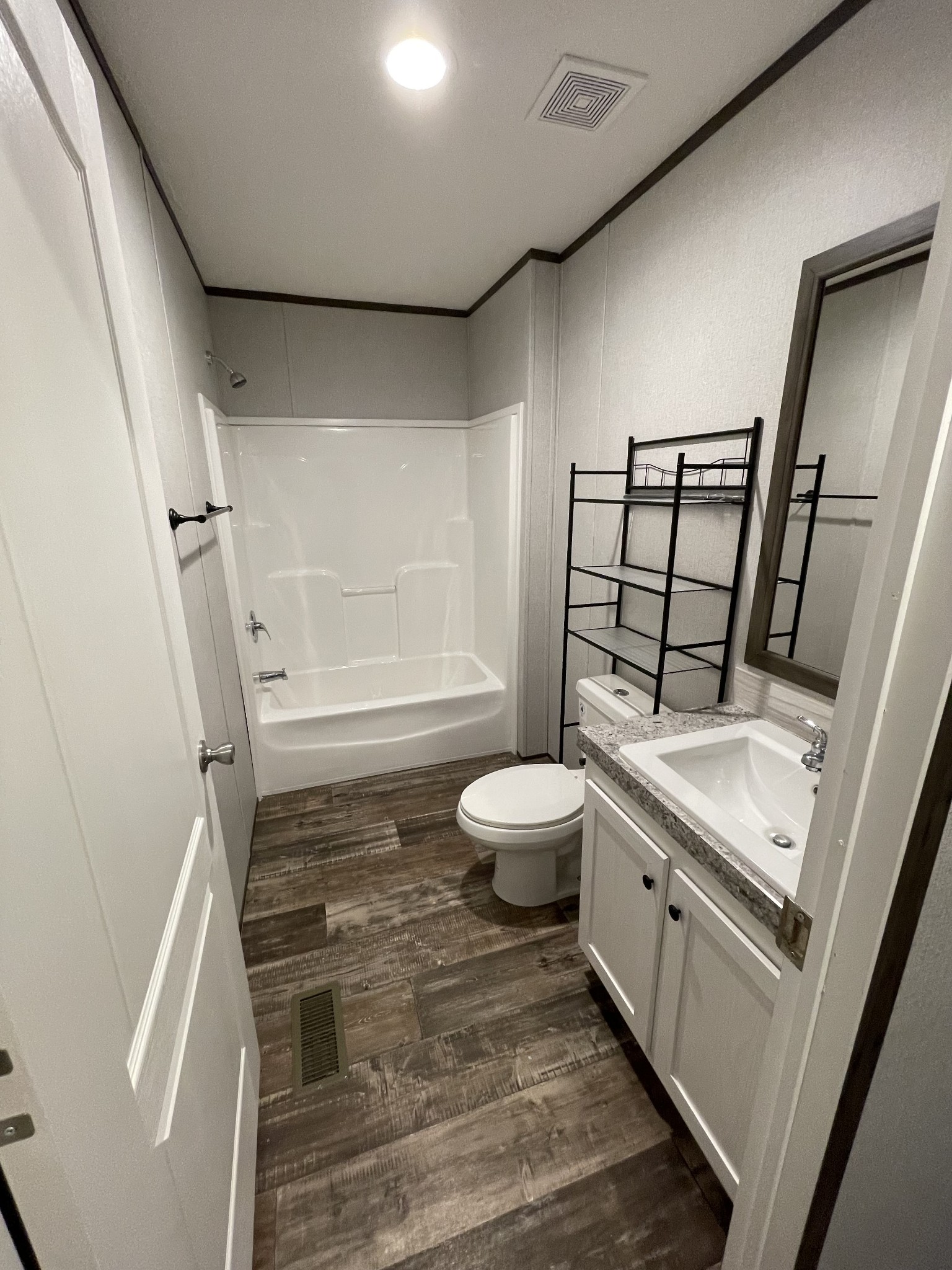 826 Pointe Lane Lafayette, TN 37083 - Photo 18 of 21 a bathroom with a granite countertop sink toilet and shower