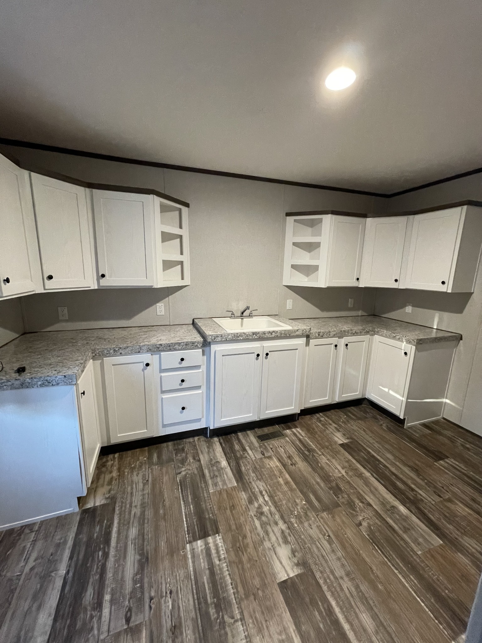 826 Pointe Lane Lafayette, TN 37083 - Photo 19 of 21 a kitchen with granite countertop a sink a stove and cabinets