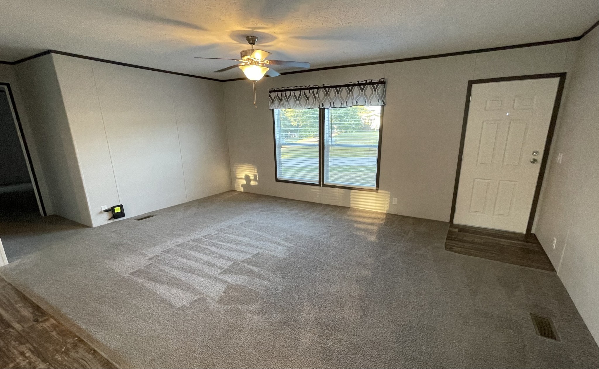 826 Pointe Lane Lafayette, TN 37083 - Photo 7 of 21 an empty room with windows and fan