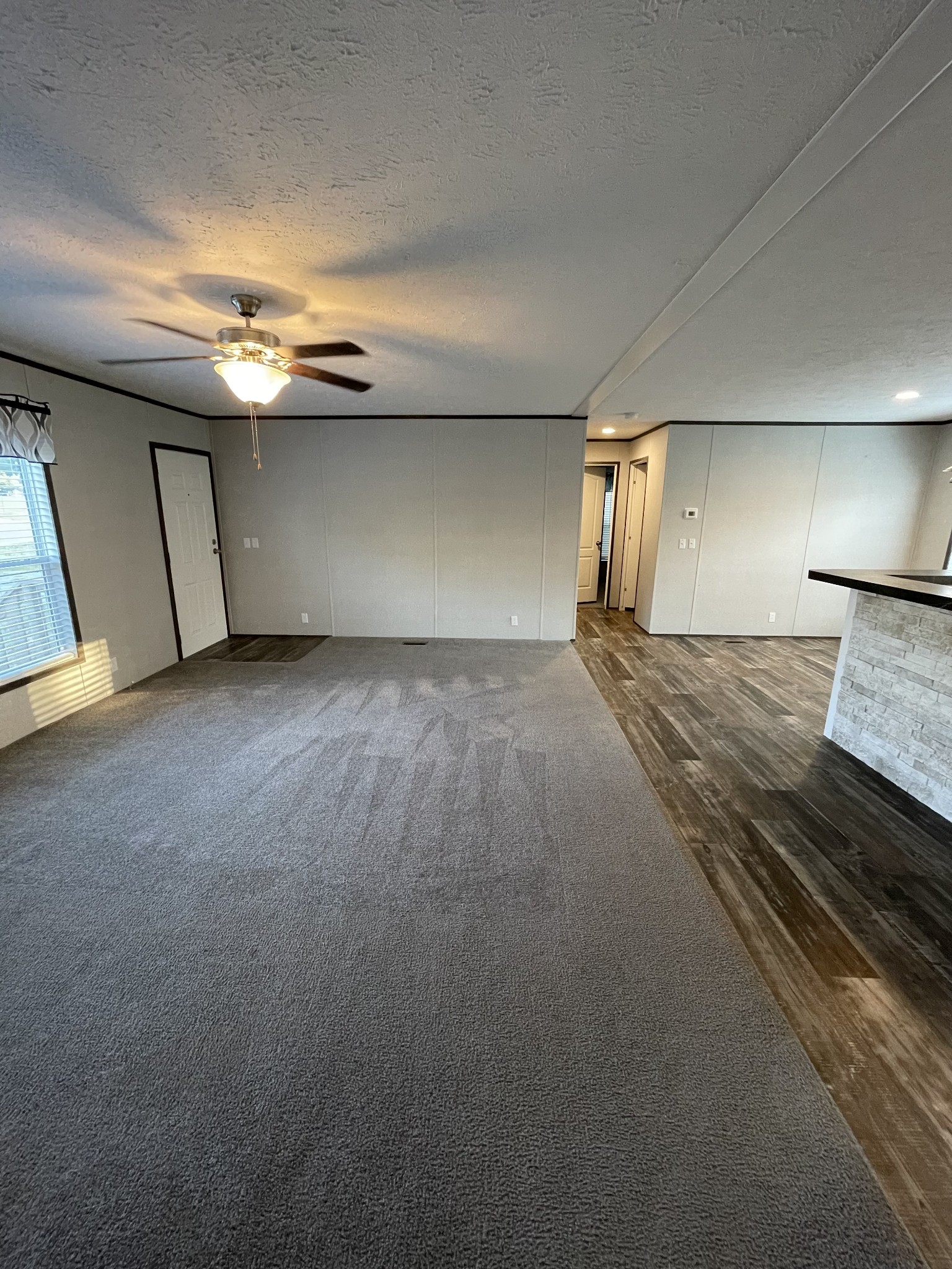 826 Pointe Lane Lafayette, TN 37083 - Photo 8 of 21 a view of an empty room with a fireplace and a window
