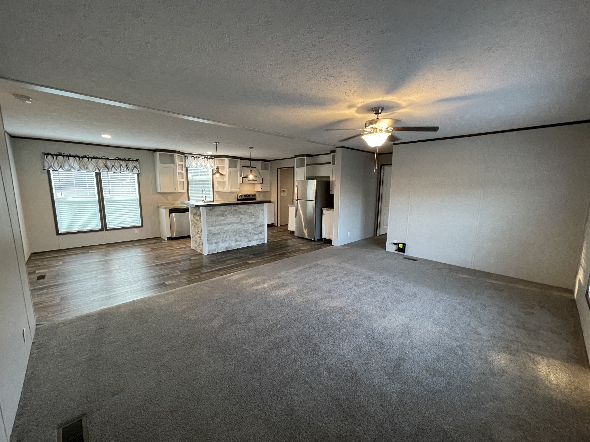 826 Pointe Lane Lafayette, TN 37083 - Photo 10 of 21 a living room with furniture and a chandelier
