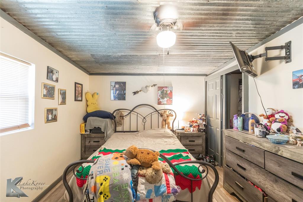 576 McCartney Lane Tye, TX 79563 - Photo 13 of 38 a bedroom with bed and a window