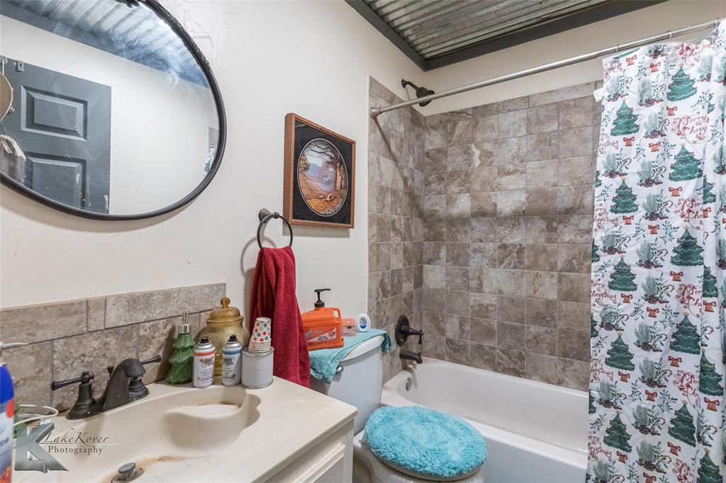 576 McCartney Lane Tye, TX 79563 - Photo 19 of 38 a bathroom with a sink and a mirror