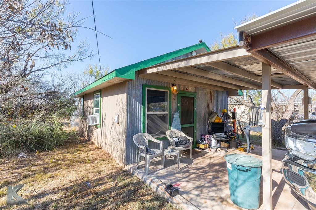 576 McCartney Lane Tye, TX 79563 - Photo 28 of 38 a patio with table and chairs and potted plants