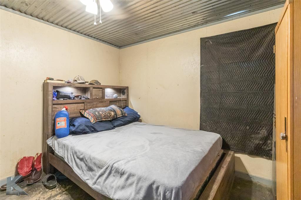 576 McCartney Lane Tye, TX 79563 - Photo 32 of 38 a bedroom with a bed and a window