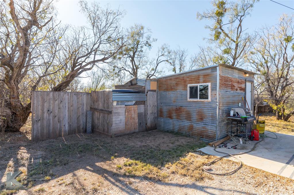 576 McCartney Lane Tye, TX 79563 - Photo 36 of 38 a backyard of a house with barbeque oven tree