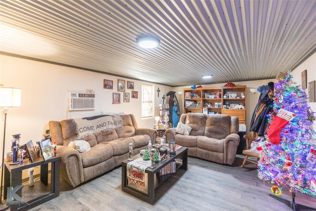 576 McCartney Lane Tye, TX 79563 - Photo 8 of 38 a living room with furniture and a bookshelf