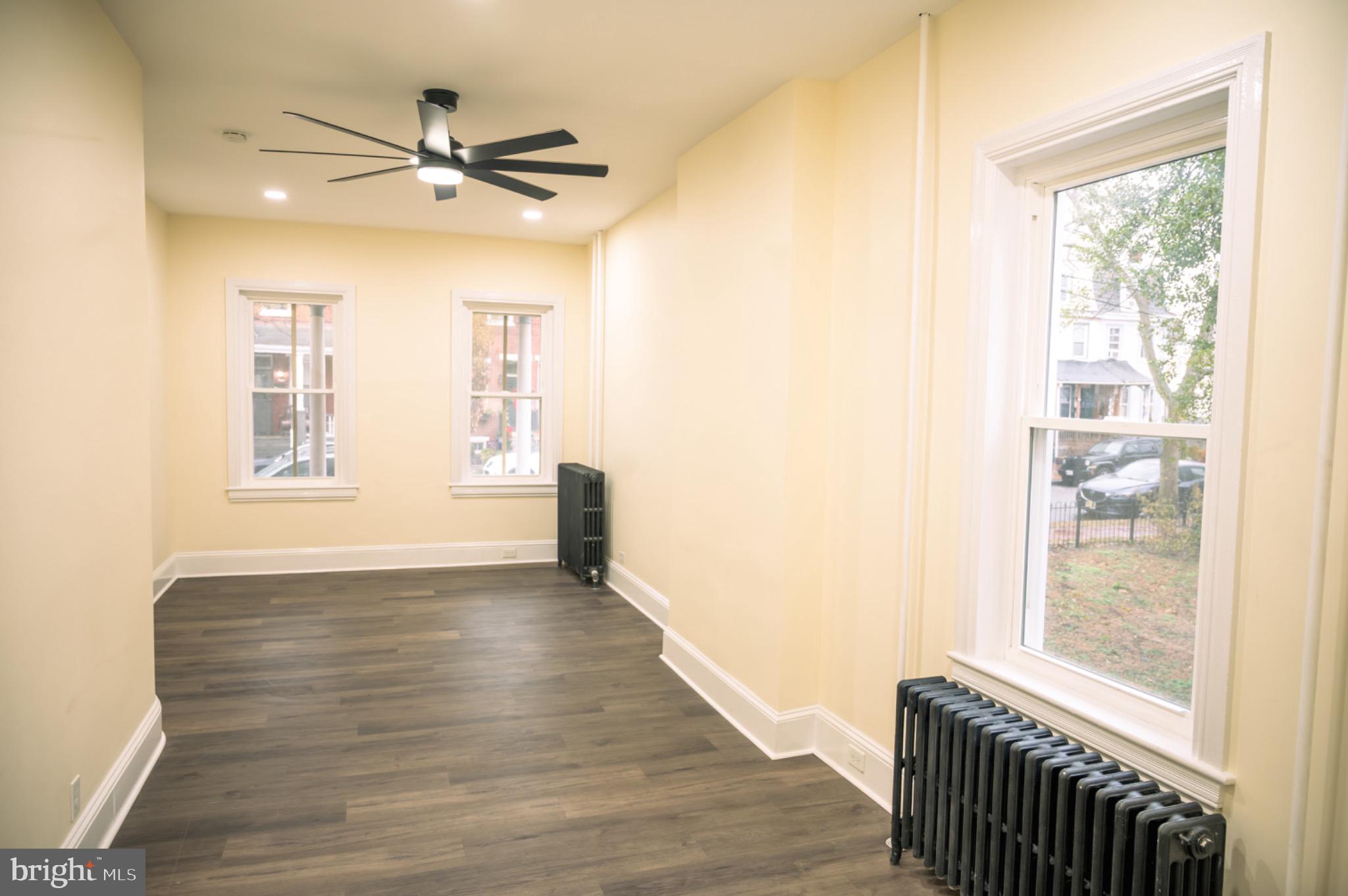 462 Locust Avenue Burlington, NJ 08016 - Photo 8 of 30 a view of an empty room with a window and wooden floor