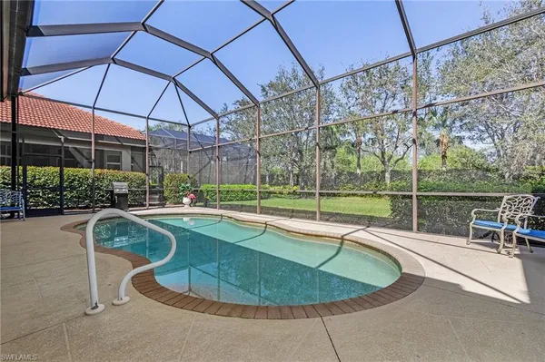a view of a swimming pool with a patio