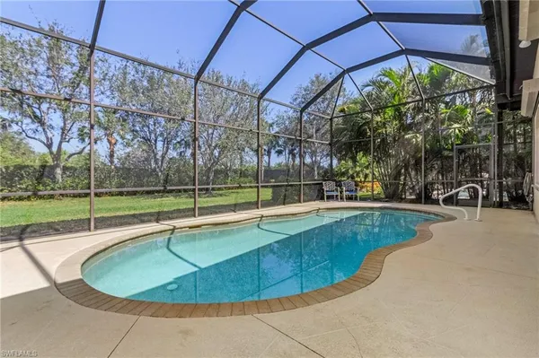 a view of a swimming pool with a backyard