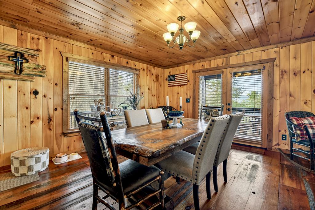 71 Rising Fawn Drive Mineral Bluff, GA 30559 - Photo 14 of 66 a view of a dining room with furniture window and wooden floor