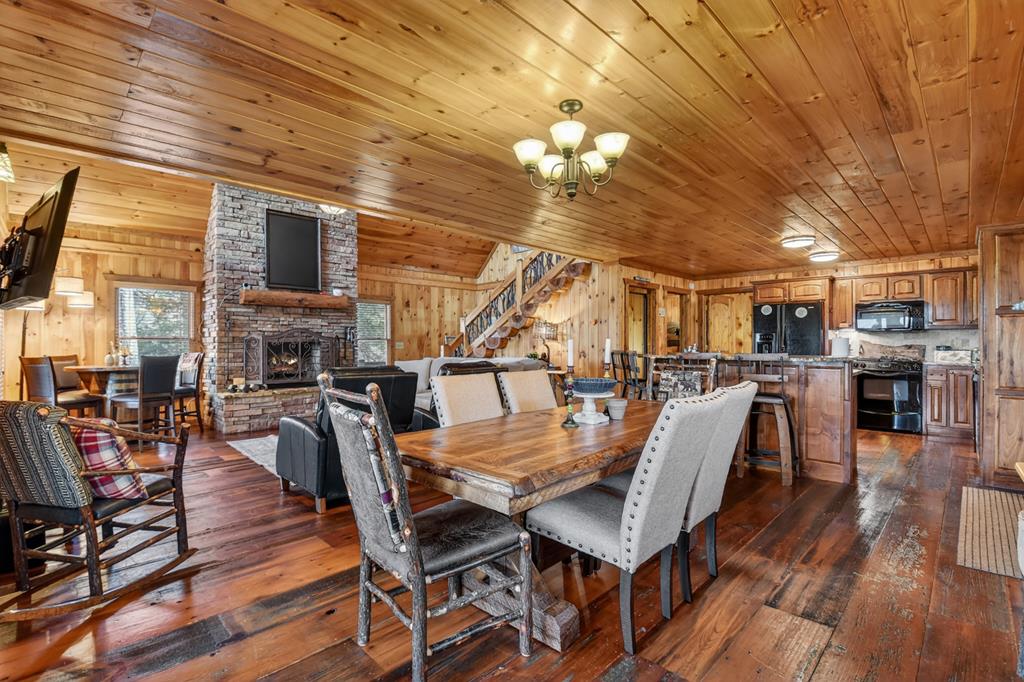 71 Rising Fawn Drive Mineral Bluff, GA 30559 - Photo 15 of 66 a view of a dining room with furniture and wooden floor