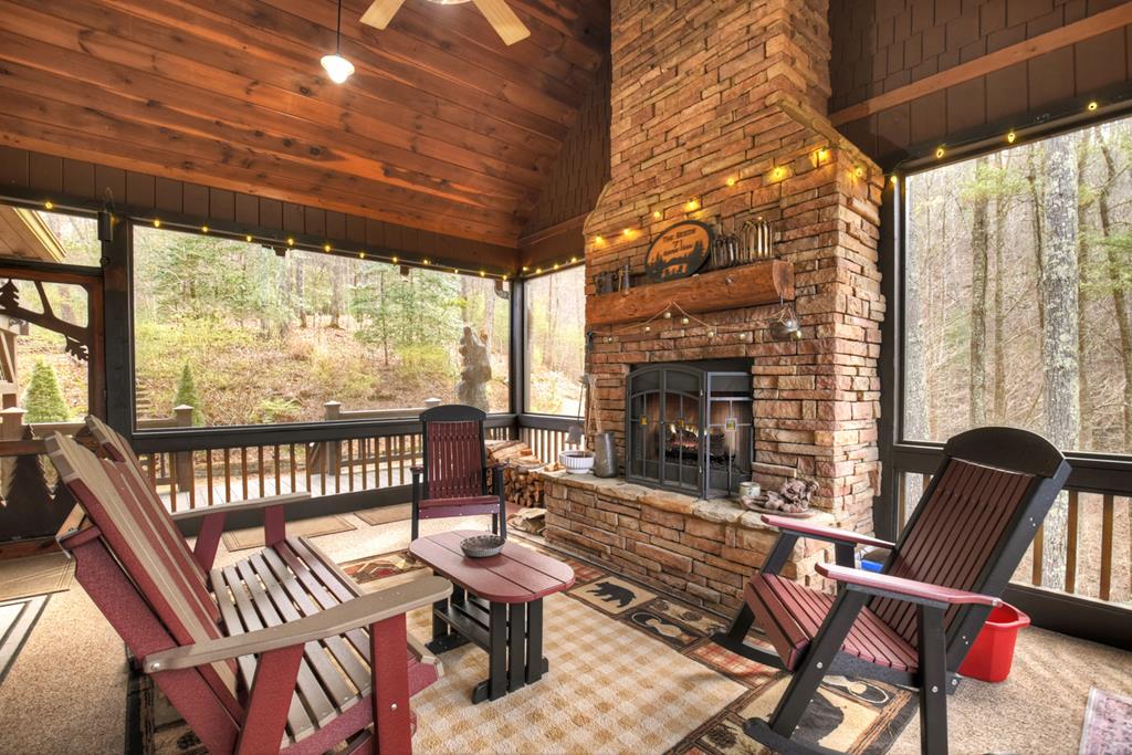71 Rising Fawn Drive Mineral Bluff, GA 30559 - Photo 19 of 66 a outdoor living space with furniture and a fireplace