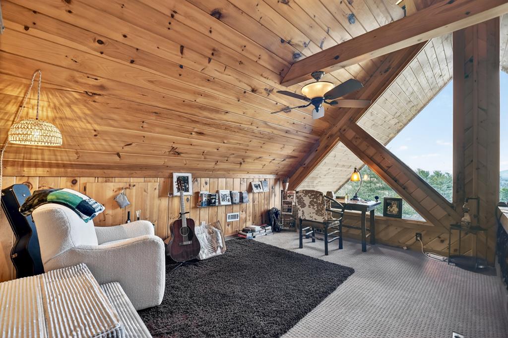 71 Rising Fawn Drive Mineral Bluff, GA 30559 - Photo 26 of 66 a living room with furniture and a table