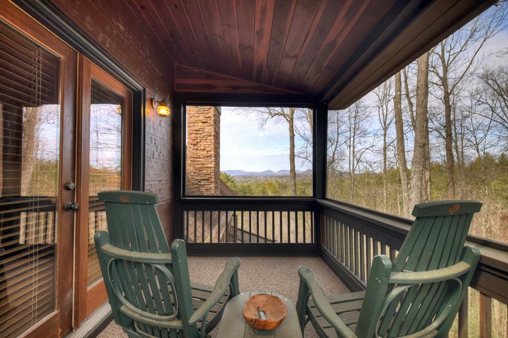 71 Rising Fawn Drive Mineral Bluff, GA 30559 - Photo 31 of 66 a view of a two chairs and table in the balcony
