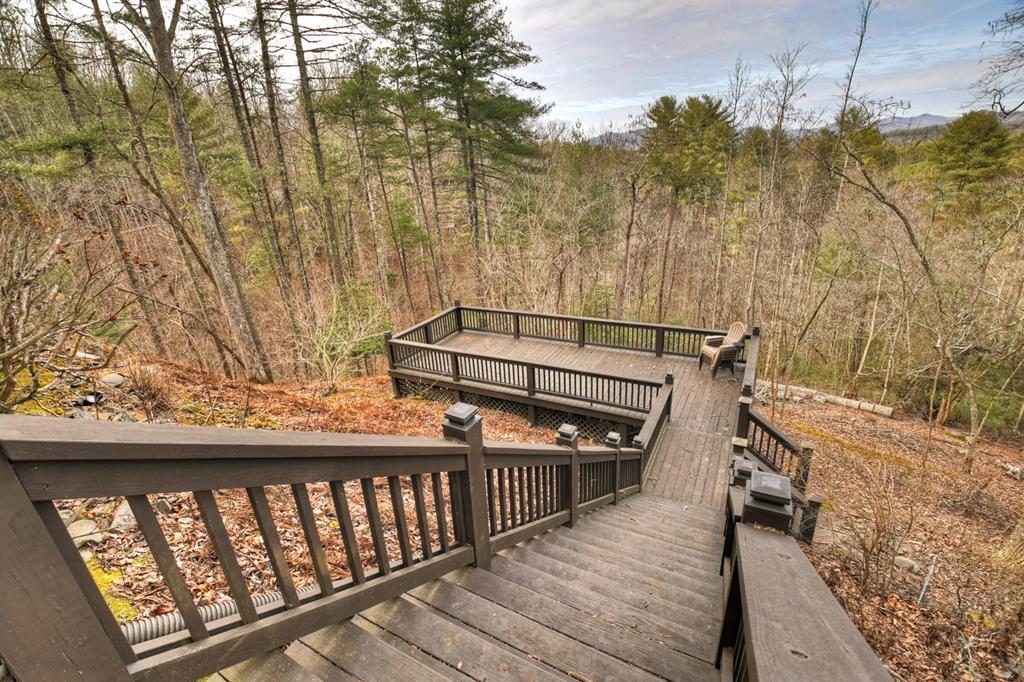 71 Rising Fawn Drive Mineral Bluff, GA 30559 - Photo 44 of 66 a view of a balcony with wooden floor and fence