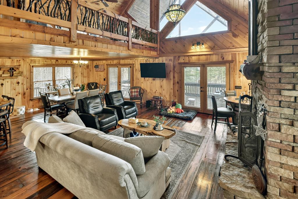 71 Rising Fawn Drive Mineral Bluff, GA 30559 - Photo 5 of 66 a living room with furniture a large window and chairs