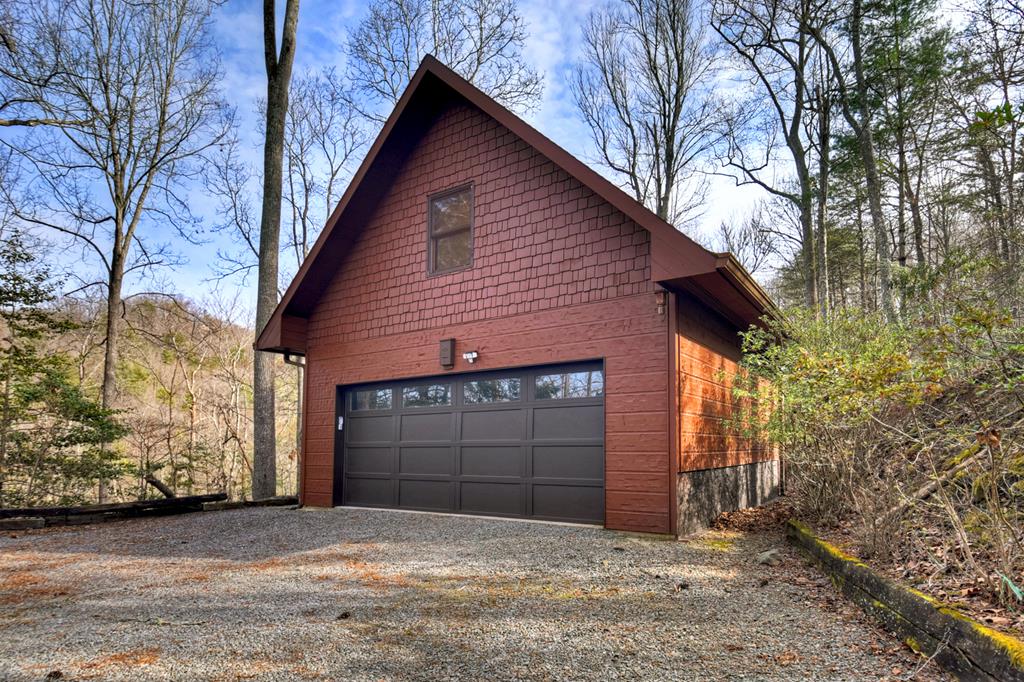 71 Rising Fawn Drive Mineral Bluff, GA 30559 - Photo 57 of 66 a front view of a house with garage