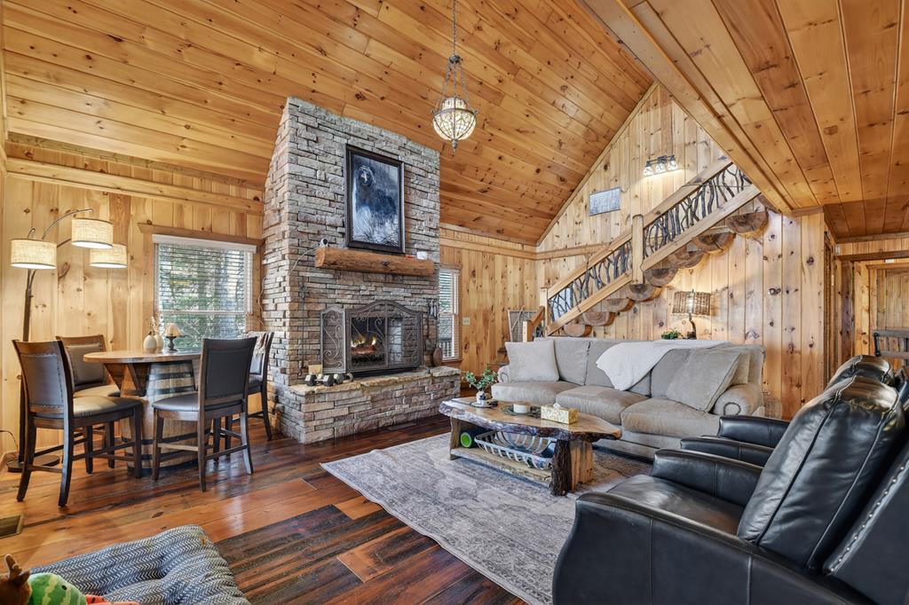 71 Rising Fawn Drive Mineral Bluff, GA 30559 - Photo 8 of 66 a living room with furniture and a fireplace