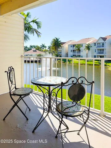 a view of a chairs and table in patio