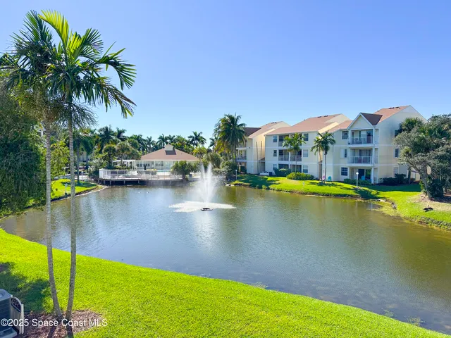 a living room with furniture and a dining table