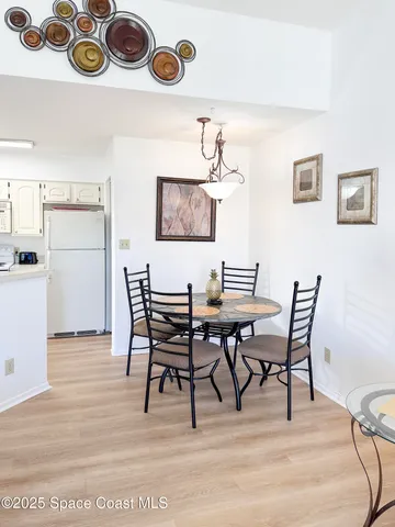 a living room with furniture and painting on the wall