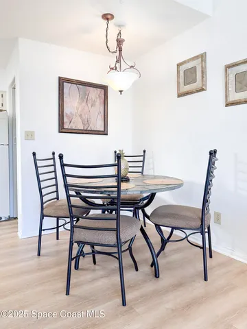 a kitchen with a sink a refrigerator and a stove