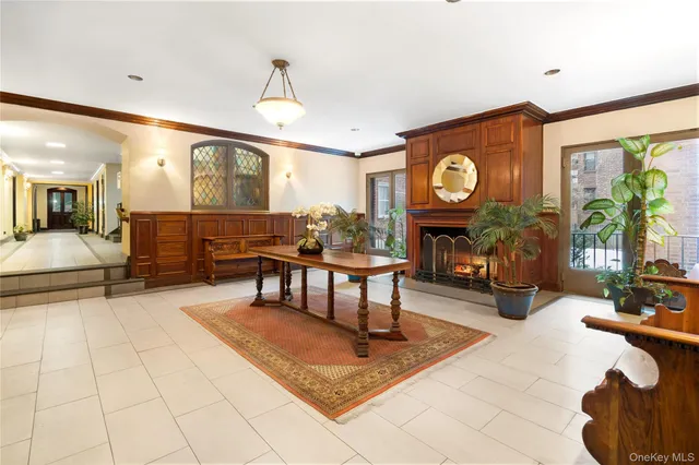 a living room with furniture a window and a clock