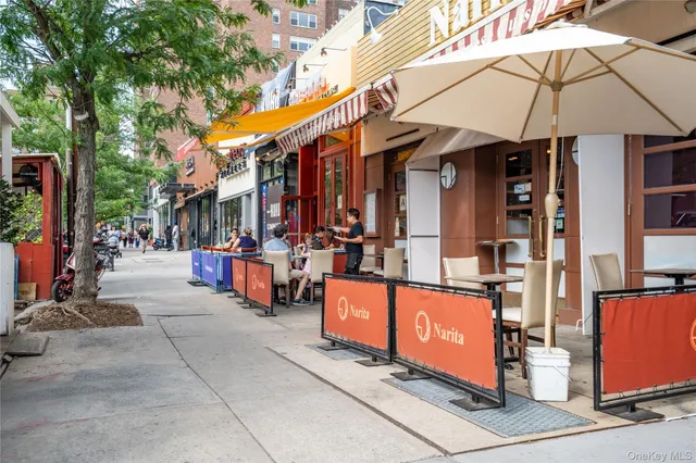 a aerial view of a house with garden space and street view