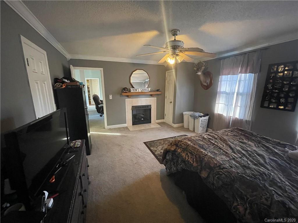 139 Bentley Town Road Union, SC 29379 - Photo 11 of 17 a spacious bedroom with a bed dresser and a window