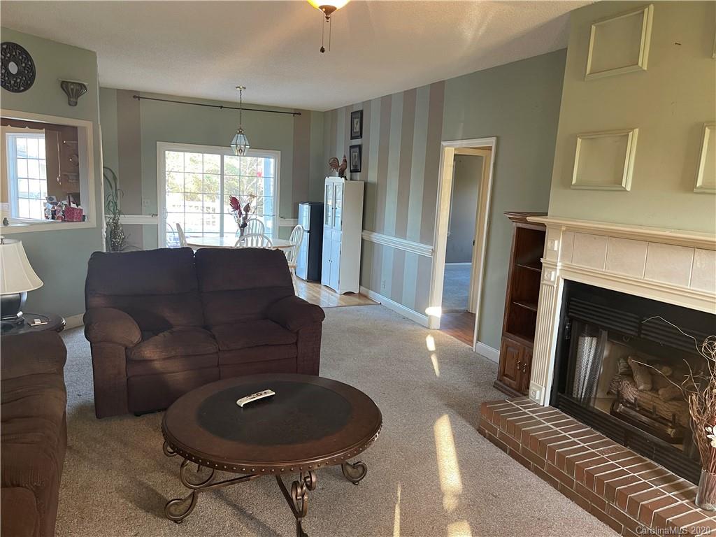 139 Bentley Town Road Union, SC 29379 - Photo 5 of 17 a living room with furniture and a fireplace